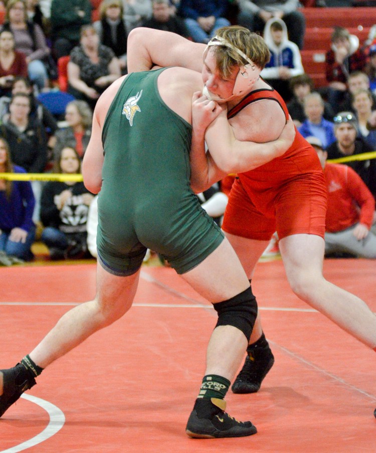Cony's Aaron Lettre, right, wrestles Oxford Hills Cole Dunham in the 182-pound championship bout during the Class A meet Saturday at Cony High School in  Augusta. 