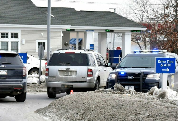 Three police vehicles block the entrance to the Bangor Savings Bank on Waterville Commons Drive on Feb. 12 after a robbery there. The robbery suspect, Jason Mackenrodt, 37, was sentenced Thursday to five years in prison for the crime.