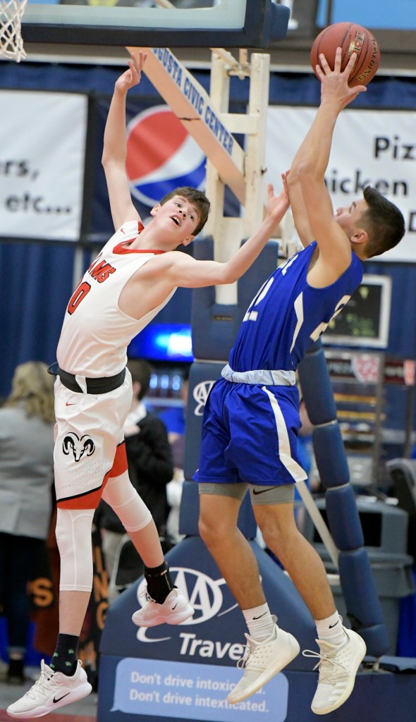 Cony's Luke Briggs can't collect a rebound from Lawrence's Jacob Patterson during a Class A North semifinal Wednesday in Augusta. 