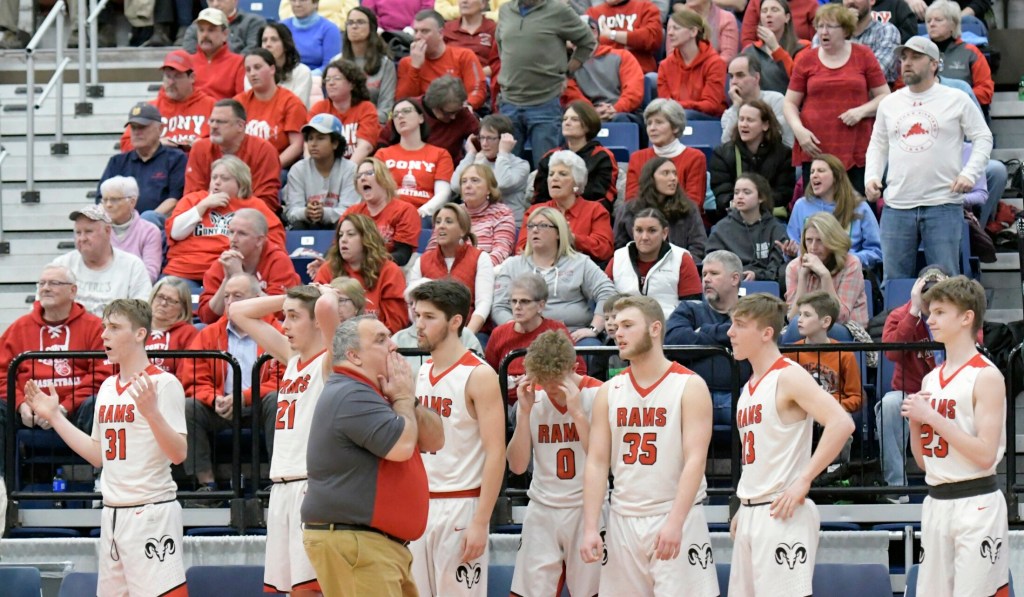 Cony High School's bench and fans react to the last moments of a tournament basketball game against Lawrence High School on Wednesday at the Augusta Civic Center.