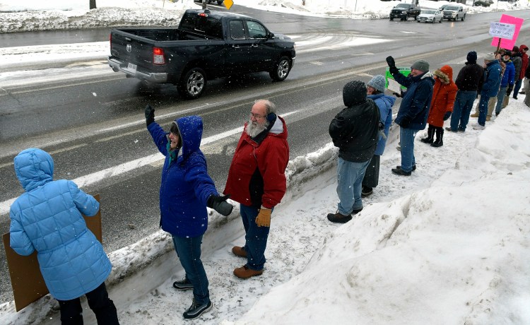 Protestors gather Monday outside the Muskie Federal Building in Augusta to protest the emergency declaration issued by President Donald Trump to create a wall between the United States and Mexico.