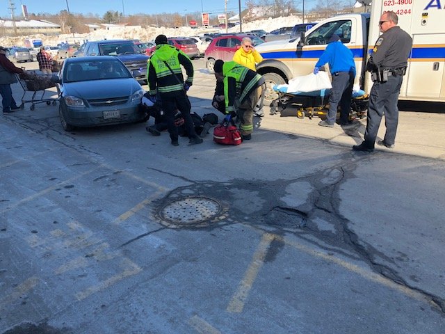 An older woman was struck by a car in Elm Plaza off upper Main Street in Waterville on Tuesday. The driver of the car that struck the woman said she was blinded by the sun.