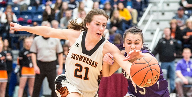 Skowhegan senior Annie Cooke goes for a loose ball with Hampden's Alydia Brilliant during the Class A North championship game at the Augusta Civic Center.