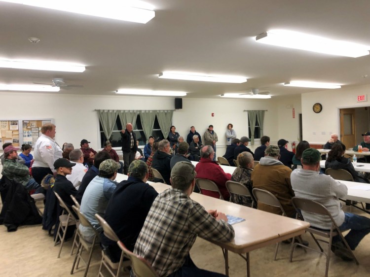 Thorndike selectmen meet Wednesday night to discuss concerns that Waldo County officials have with the town's fire department. All but one of the department's firefighters, seen seated here at tables, got up and resigned in protest. 