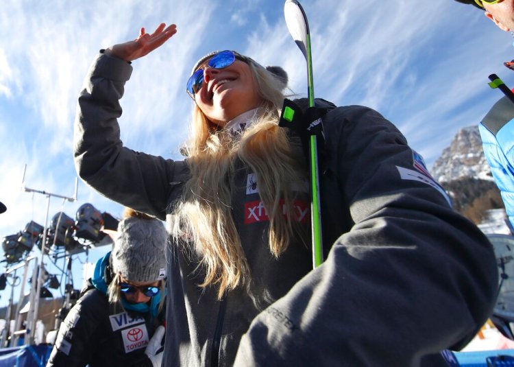 United States' Lindsey Vonn waves as she stands in the finish area after completing an alpine ski, women's World Cup super-G in Cortina D'Ampezzo, Italy, Sunday, Jan. 20, 2019.