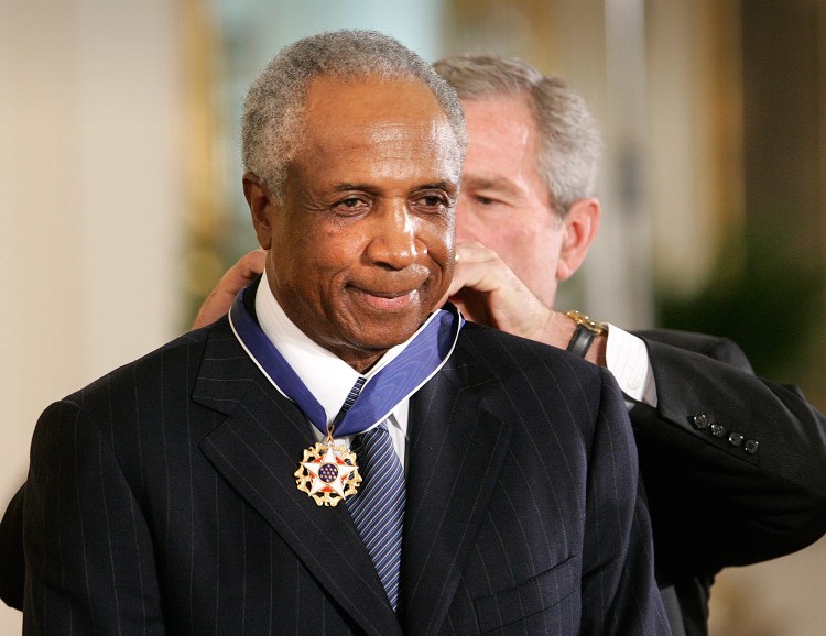 President George W. Bush gives Frank Robinson the Presidential Medal of Freedom Award at the White House on Nov. 9, 2005.