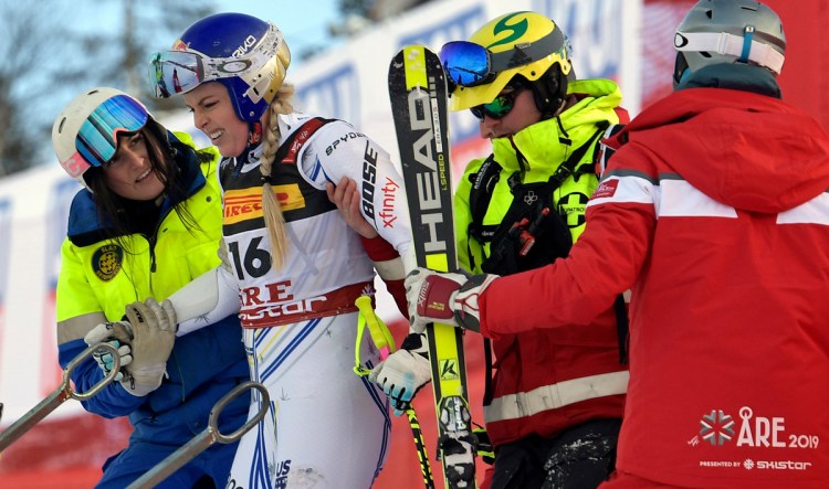 United States' Lindsey Vonn is assisted after crashing during the women's super G at the alpine ski World Championships, in Are, Sweden, on Tuesday.