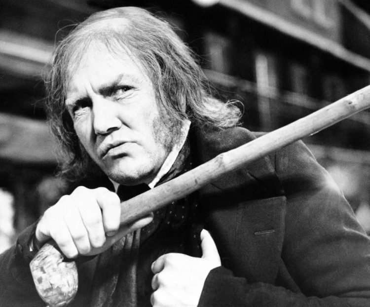 British actor Albert Finney waves his cane while playing the title role in "Scrooge," at Shepperton Studios on Jan. 15, 1970. 