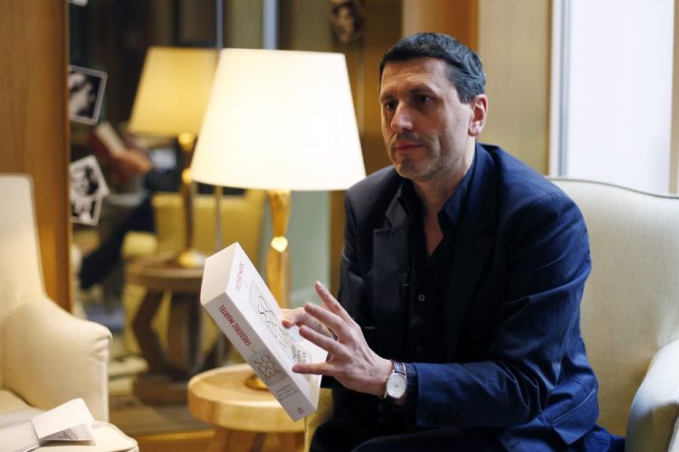 French writer Frederic Martel gestures during an interview with Associated Press, in Paris, Friday, Feb. 15, 2019. In the explosive book "In the Closet of the Vatican" author Frederic Martel describes a gay subculture at the Vatican and calls out the hypocrisy of Catholic bishops and cardinals who in public denounce homosexuality but in private lead double lives. 