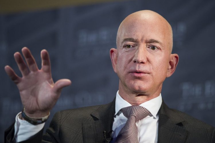 Jeff Bezos, Amazon founder and CEO, speaks at The Economic Club of Washington's Milestone Celebration in Washington on Sept. 13, 2018. Bezos says the National Enquirer is threatening to publish nude photographs of him unless his private investigators back off the tabloid that detailed the billionaire’s extramarital affair.