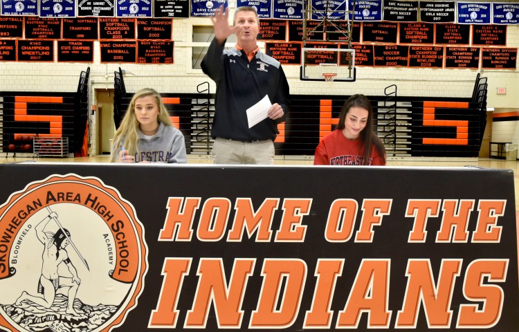 Skowhegan Area High School athletic director Jon Christopher speaks during a ceremony in which field hockey players Lizzie York, left, and Maliea Kelso signed letters of intent on Nov. 18, 2019. 