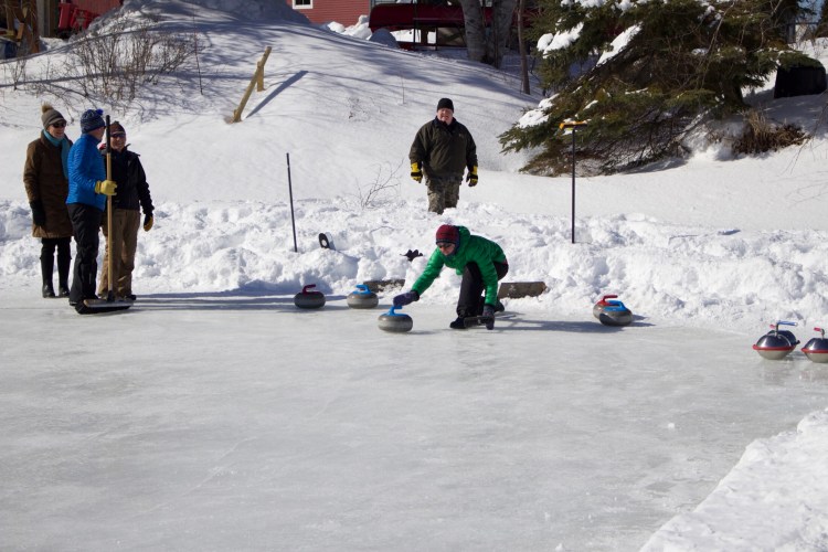 Lucy Simonds shows off her curling skills during the Fourth annual Rangeley Winterpaloozah! on Feb. 17 in Rangeley.