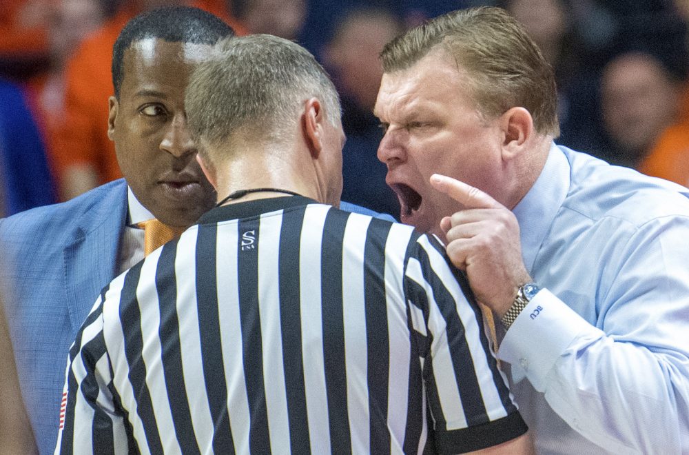 Illinois head coach Brad Underwood gives a piece of his mind to a referee as asst. coach Ron Coleman listens during the second half of an NCAA college basketball game against Penn State in Champaign, Ill., Saturday, Feb. 23, 2019.(AP Photo/Robin Scholz)