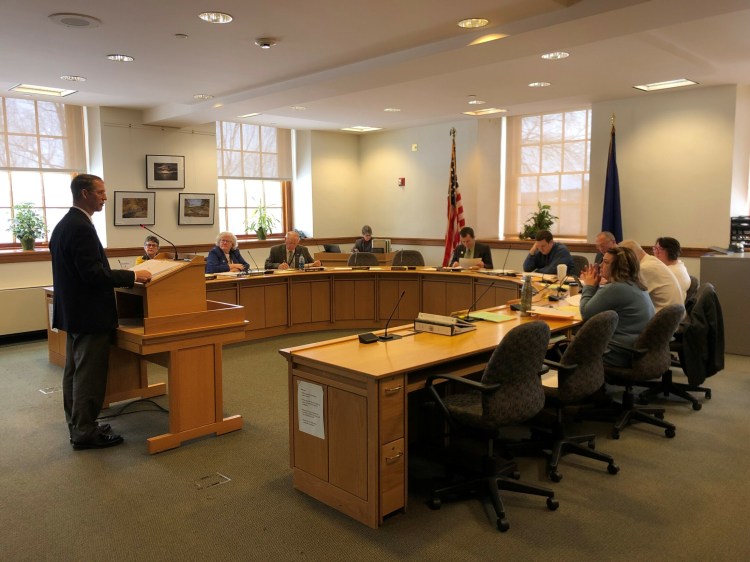 China Town Manager Dennis Heath defends a bill before the Legislature's Taxation Committee on Wednesday that would allow municipalities to opt of assessing certain taxes.