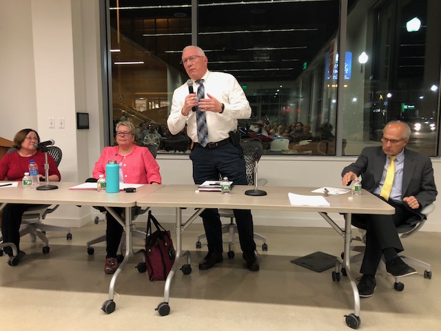 Lisa Hallee, Charlotte Warren, Waterville Police Chief Joseph Massey and Gordon Smith at a forum about the opioid crisis in Waterville on Thursday.