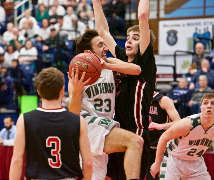 Winthrop's Jared Mclaughlin goes up for a layup against the defense of Hall-Dale Ashtyn Abbott during the Class C South regional final Saturday in Augusta.