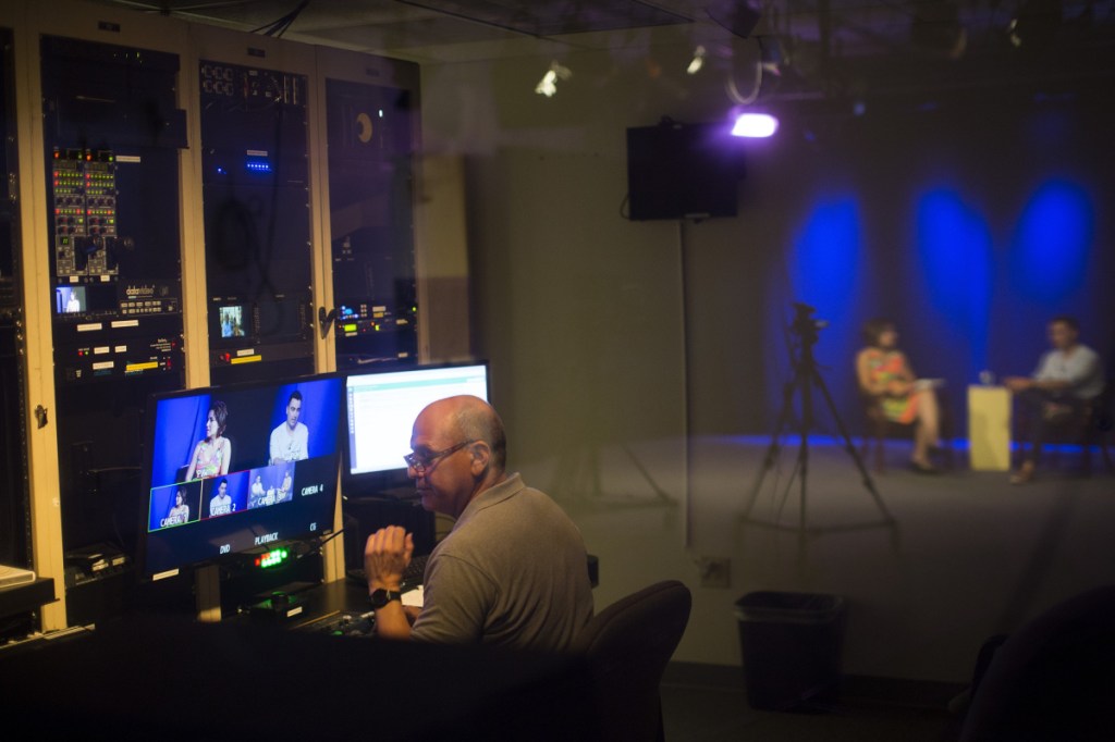 File photo: Tom Handel works in the control room at Community Television Network in Portland last year. Most municipal agreements give cable companies access to their communities in exchange for a franchise fee and a dedicated, local cable channel and broadcast equipment.