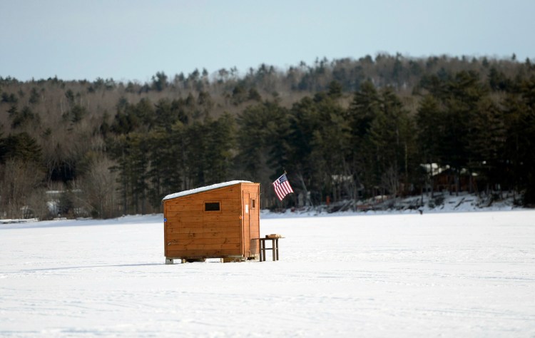 A traditional ice fishing shack on Long Lake in Naples Saturday, January 19, 2019. 