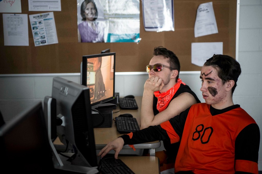 Winslow High School seniors Devin Daigneault, left, and Nick Tiner work on their computers during computer programming class at Winslow High School on Friday. Next school year, the high school will introduce an AP Computer Science course called the Beauty and Joy of Computing for students.