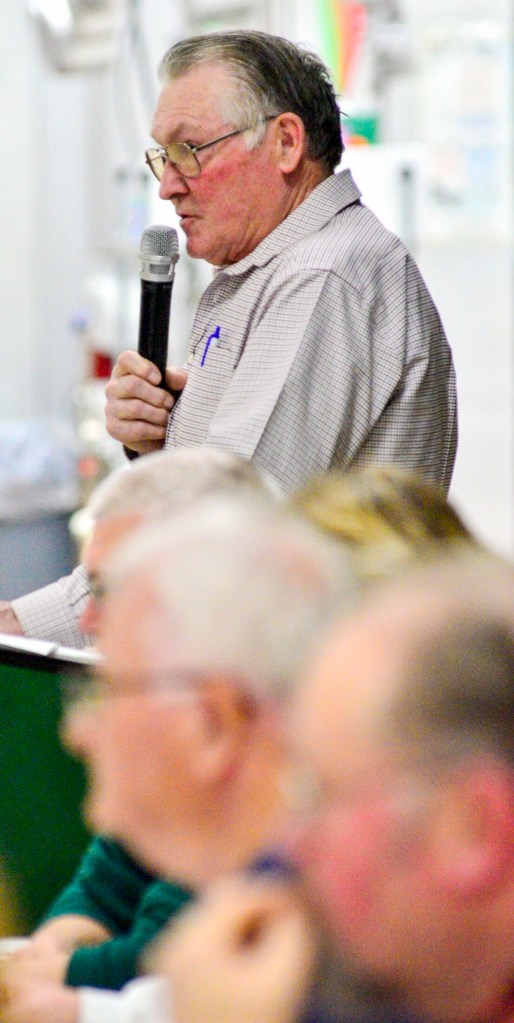Moderator Bill Lynds runs the Anson Town Meeting on Saturday in the Carrabec High School gymnasium. Voters passed 42 warrant articles in under an hour. 