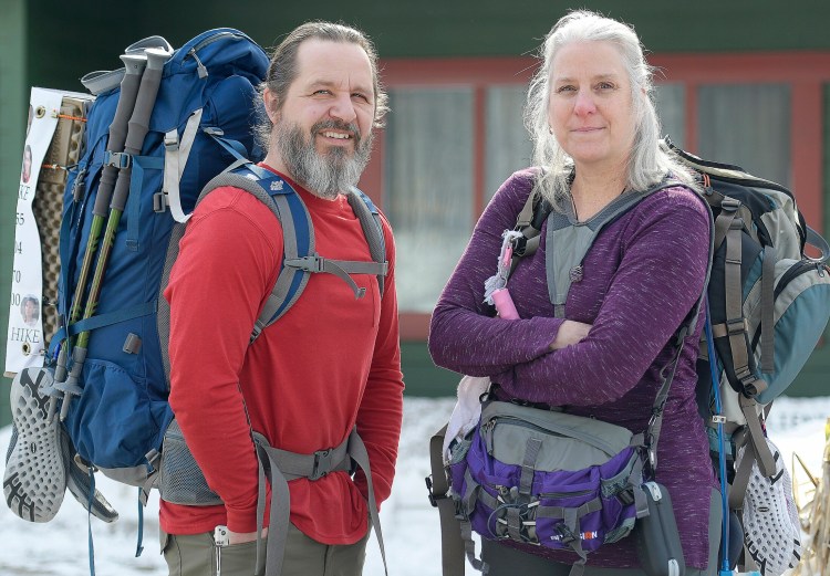 Stephen and Karen Hardy, with their knapsacks adorned with overdose victims, at their Belgrade home on Wednesday. The couple plan to hike a portion of the Appalachian Trail to raise drug overdose awareness and honor victims.