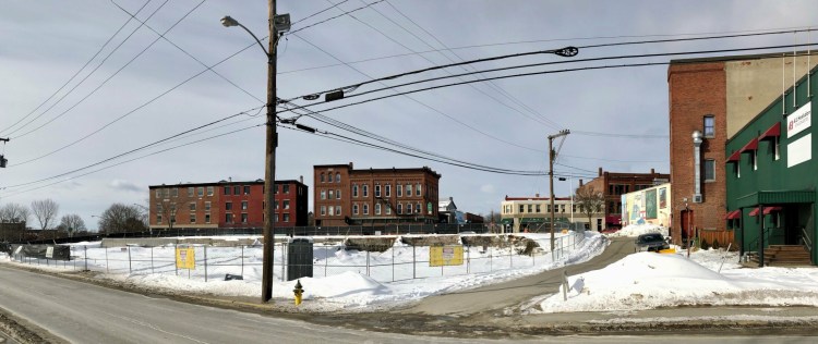 The site of Colby College's planned hotel and restaurant in downtown Waterville is seen Thursday morning. 