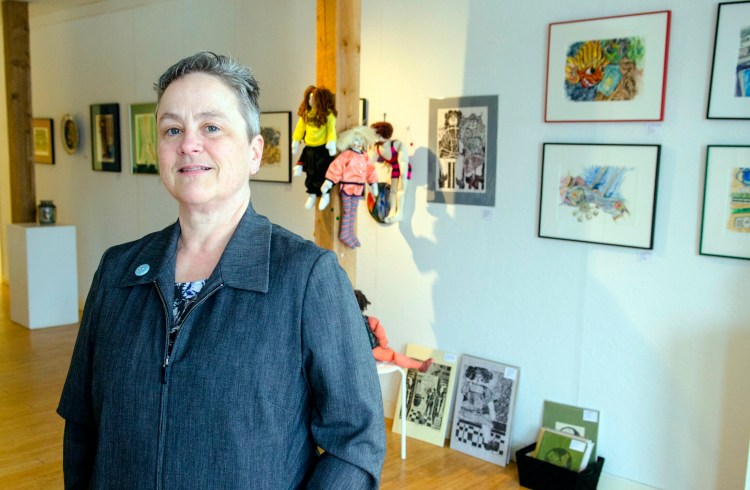Executive director Deb Fahy, who is stepping down as longtime executive director of the Harlow Gallery, is seen Friday at the on Water Street gallery in Hallowell. 