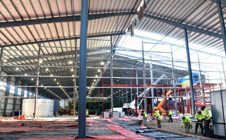 Workers inside the three-acre Fiberight Corp. solid waste processing and recycling facility in Hampden on Dec. 13, 2018, were able to bring the plant close to being finished in the ensuing months. The Hampden plant is scheduled to begin accepting waste on April 15.