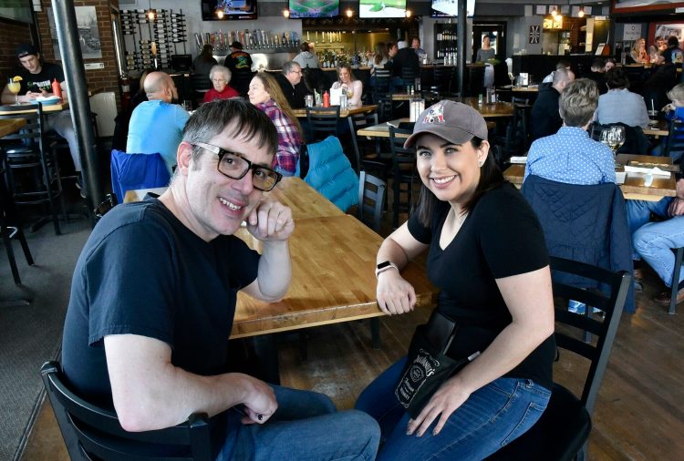Silver Street Tavern employees Zack Denis and Samantha Clark take a break from serving customers Sunday to talk about the unprecedented $2,000 tip they and other employees will split from an anonymous customer at the Waterville restaurant on Saturday.
