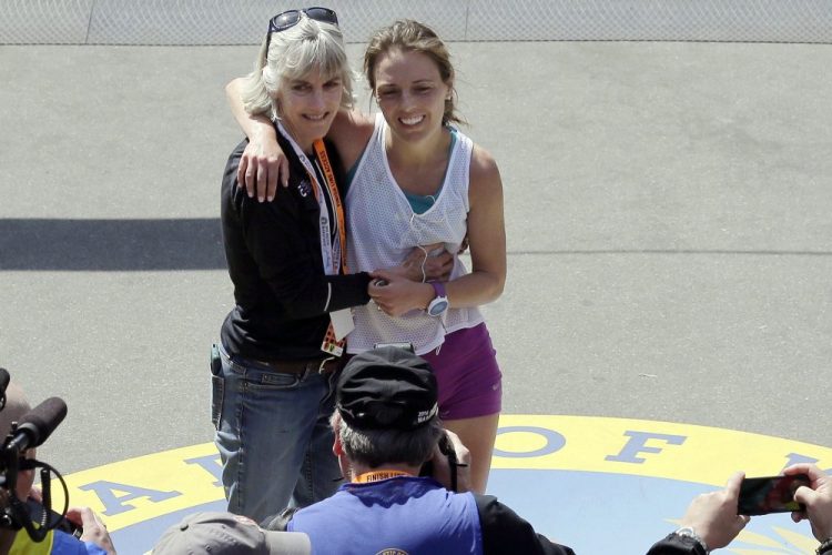 Former Boston Marathon women's division winner Joan Benoit Samuelson, left, poses with her daughter Abby Samuelson, of Portland, Ore. on April 18. 2016, who had just completed the 120th Boston Marathon in Boston. 