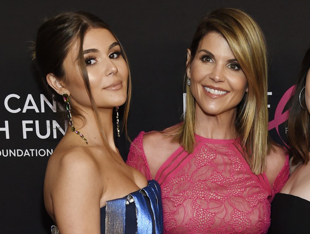 FILE - In this Feb. 28, 2019 file photo, actress Lori Loughlin poses with her daughter Olivia Jade Giannulli, left, at the 2019 "An Unforgettable Evening" in Beverly Hills, Calif. Felicity Huffman and Loughlin have worked steadily as respected actresses and remained recognizable if not-quite-A-list names for decades. Neither has ever had a whiff of criminality or scandal tied to their name until both were charged with fraud and conspiracy Tuesday along with dozens of others in a scheme that according to federal prosecutors saw wealthy parents pay bribes to get their children into some of the nation’s top colleges. (Photo by Chris Pizzello/Invision/AP, File)