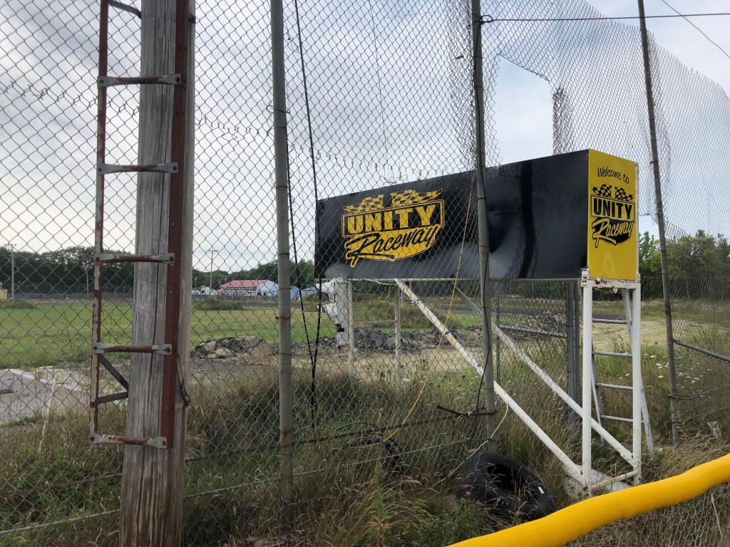 The view of the Unity Raceway frontstretch in August 2018, where all of the asphalt but the area around the start-finish line has been torn up.