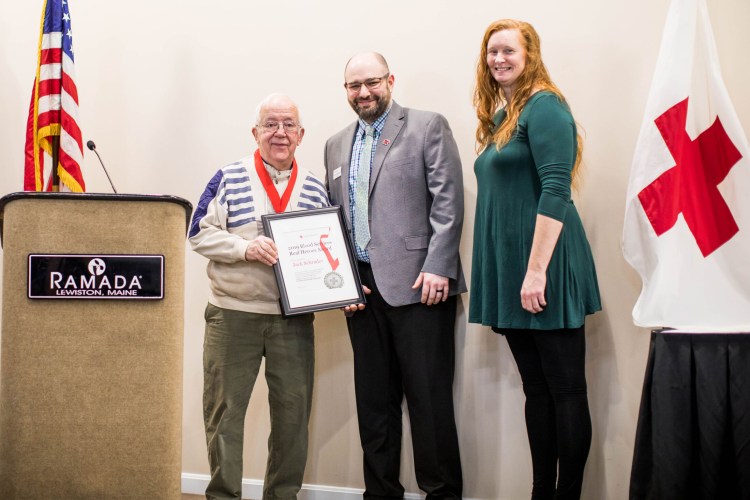 Jack Schrader,  left, recipient of the Blood Services Award,  with Johnny Blanton, Red Cross Biomedical Services District Manager, and Veronica Dumais, honorary event chairwoman of the Real Heroes Awards Breakfast of the Central and Mid Coast Maine Chapter of the American Red Cross.