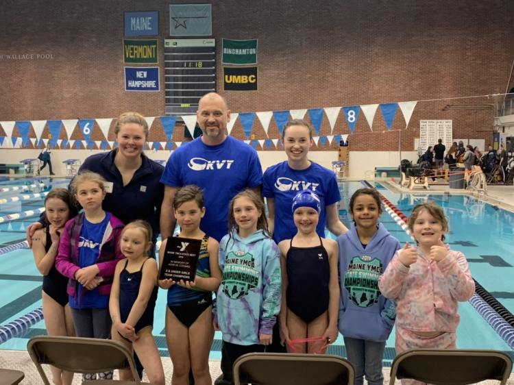 The 8 and Younger Girls  Team Champions, front from left, are Meghan Inch, Sara Fournier, Alice Lazure, Anya Johnderson, Sophia Wilcott, Gaby Lazure, Millie Story and Gudrun Ziemer. Back from left are Head Coach Sara Knight, Coach Mike Schmidt and Assistant Coach Victoria Weber.