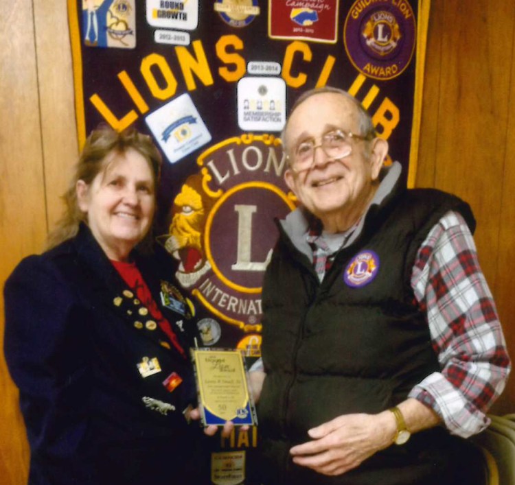 Second Vice District Governor and Club President Bunny Parks, PDG, left, with Gardiner/Augusta Lions Club Past International Director Lewis Small Sr. Small recently was honored for 50 years of Lions service.