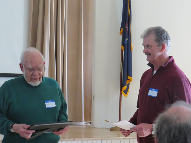 Marius Péladeau, left, of Readfield, was honored at the Readfield Historical Society’s annual meeting on March 16, for decades of preserving Maine history. Bob Harris, RHS president, presented the award.