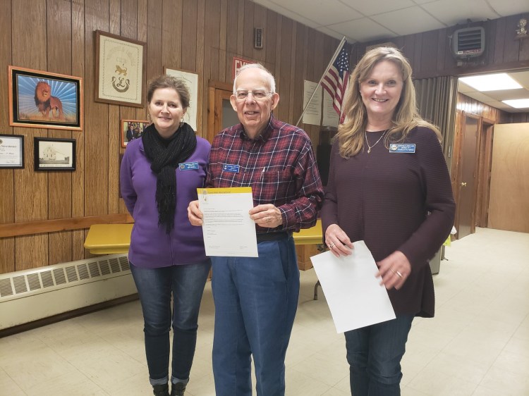 Whitefield Lions David Hayden and Charlotte Hayes were honored  for 10 years of service in the Whitefield Lions Club on Feb. 28 at the clubhouse in Coopers Mills. From left are Lions club president Kim Haskell, Lion David Hayden and Lion Charlotte Hayes.