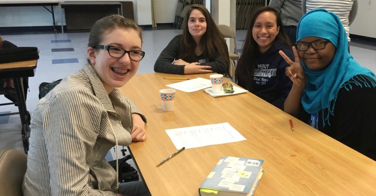 Anna Swimm, Samantha Cloutier, Rizzajem Reboquis and Fatumo Sidow bond over their poems during an Operation Breaking Stereotypes meeting during their first year together.  