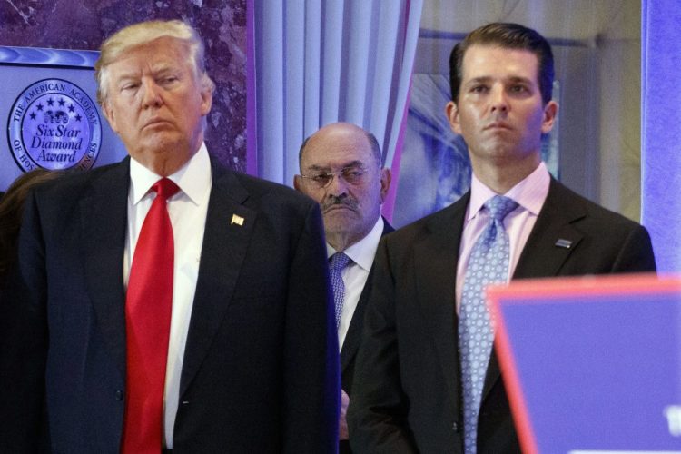 Allen Weisselberg, center, stands between President-elect Donald Trump, left, and Donald Trump Jr., at a news conference in the lobby of Trump Tower in New York in Jan. 2017. Weisselberg, chief financial officer for Donald Trump, is now in the sights of the federal probes and congressional investigations of President Donald Trump’s family business. 
