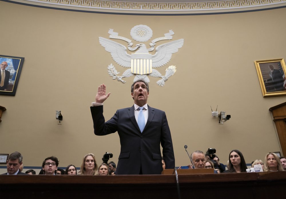 FILE- In this Feb. 27, 2019 file photo, Michael Cohen, President Donald Trump's former personal lawyer, is sworn in to testify before the House Oversight and Reform Committee on Capitol Hill in Washington. Giving Congress a who's who of President Donald Trump's allies and business associates during his testimony, Cohen rattled off more than a dozen names, providing the committee with a potential roadmap for future hearings. (AP Photo/J. Scott Applewhite, File)