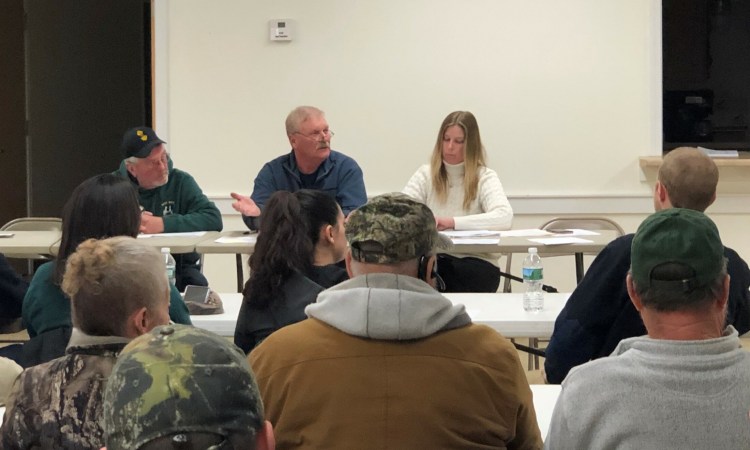 Thorndike Selectman Bob Carter, center, addresses volunteer firefighters moments before they resigned en masse at a Feb. 20 meeting. 
