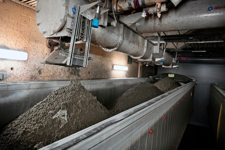 Sludge is dumped into a truck at the wastewater treatment plant in Portland in 2019.