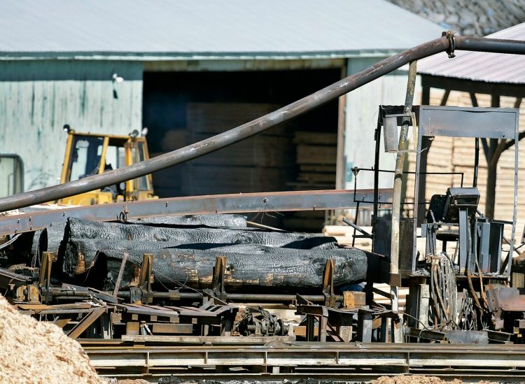 Burned wood and blades seen April 1 at the N.C. Hunt sawmill in Jefferson.