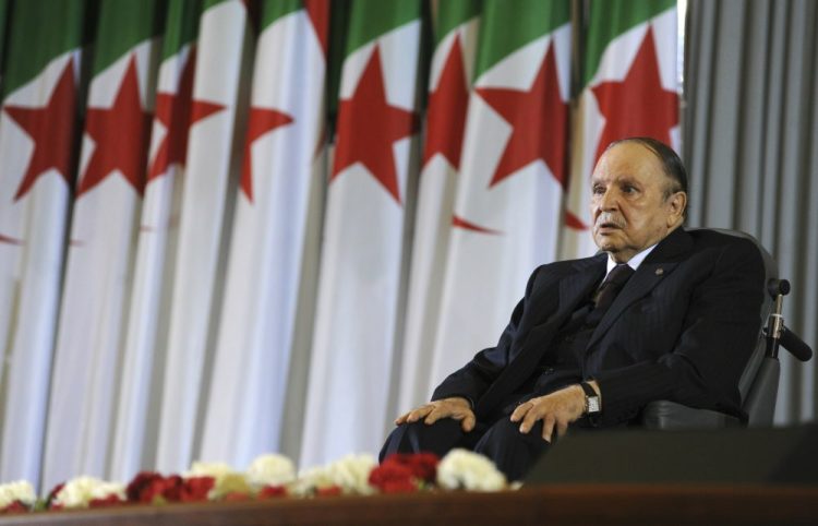 Algerian President Abdelaziz Bouteflika sits in a wheelchair in 2014. Weekly protests have demanded that he step down.