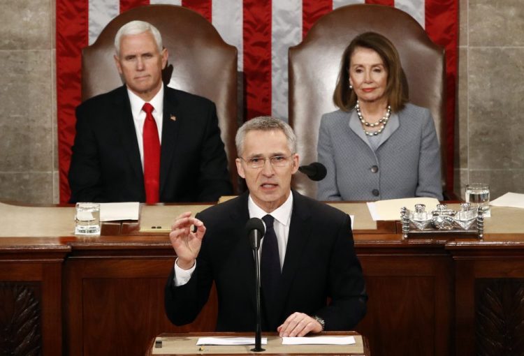 NATO Secretary General Jens Stoltenberg, standing in front of Vice President Mike Pence and House Speaker Nancy Pelosi of California, addresses a joint meeting of Congress on Capitol Hill in Washington on Wednesday.