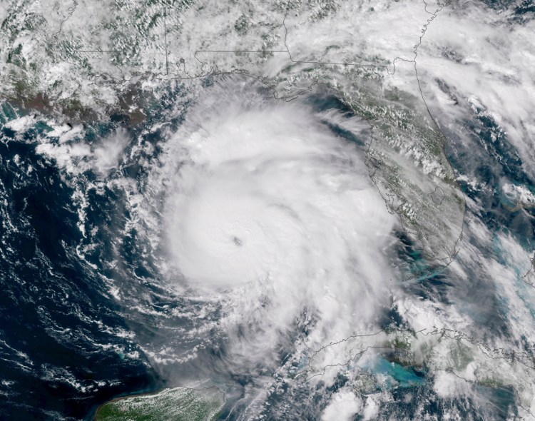 A satellite image provided by NOAA shows Hurricane Michael, center, in the Gulf of Mexico. in October of 2018.