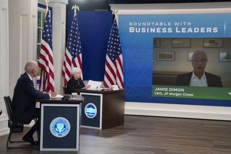 President Biden and Treasury Secretary Janet Yellen listen as Jamie Dimon, CEO of JP Morgan Chase, speaks during a meeting with business leaders about the debt limit on the White House campus on Wednesday in Washington. 