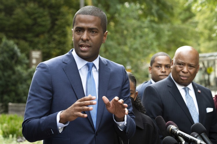 Bakari Sellers, the attorney for the families of victims killed in the 2015 Mother Emanuel AME Church massacre, speaks with reporters outside the Justice Department in Washington on Thursday. 