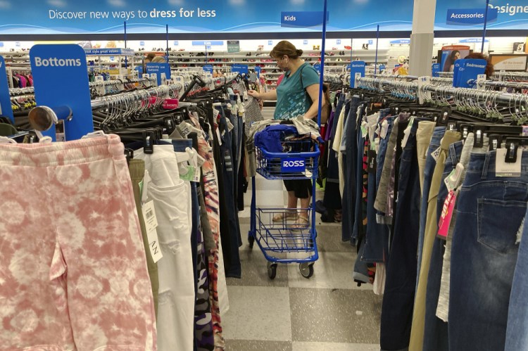 A consumer shops at a retail store in July in  Morton Grove, Ill.  Consumer prices rose 0.4 percent last month, slightly higher than August’s gain and pushing annual inflation back to the highest increase since 2008n

