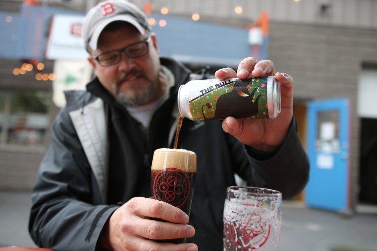 Former brewer Tom Bull pours his namesake beer, The Bull, made by Foundation Brewing.